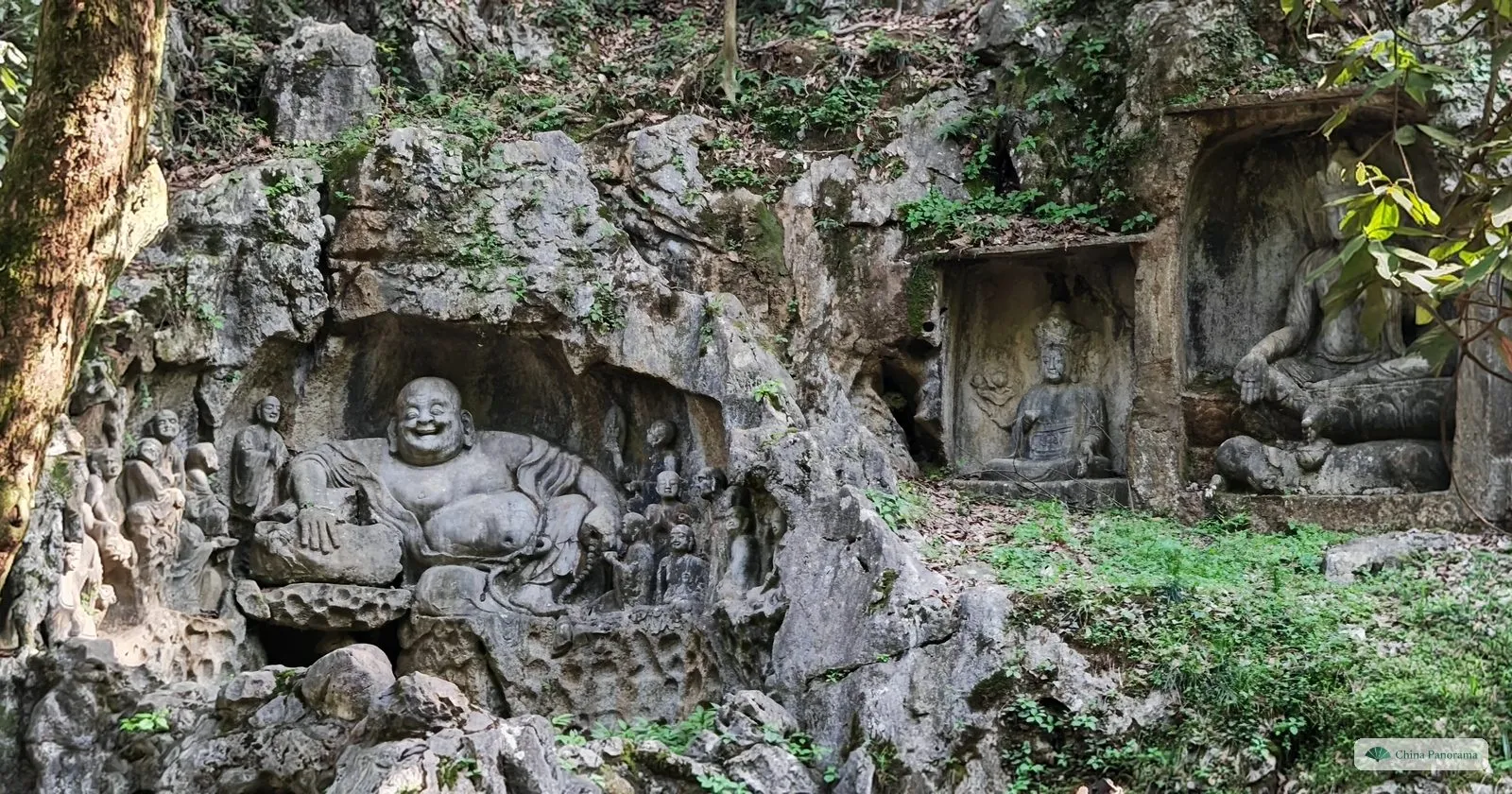 The carved laughing Buddha in a rock niche on Feilai Feng, opposite Lingyin Temple