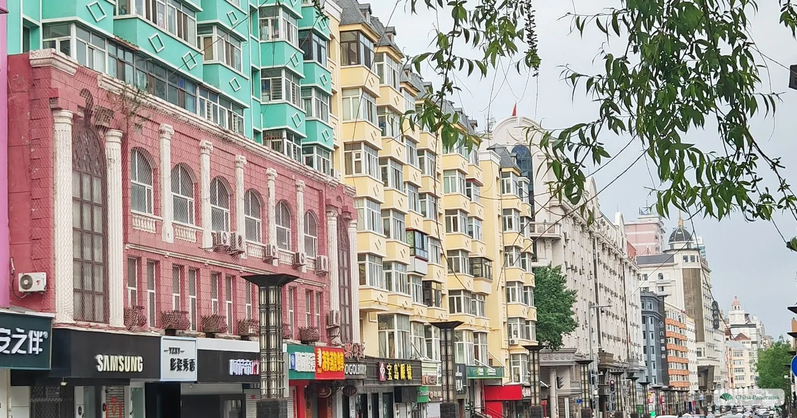 Pastel-coloured apartment facades along Gogol Street in Harbin