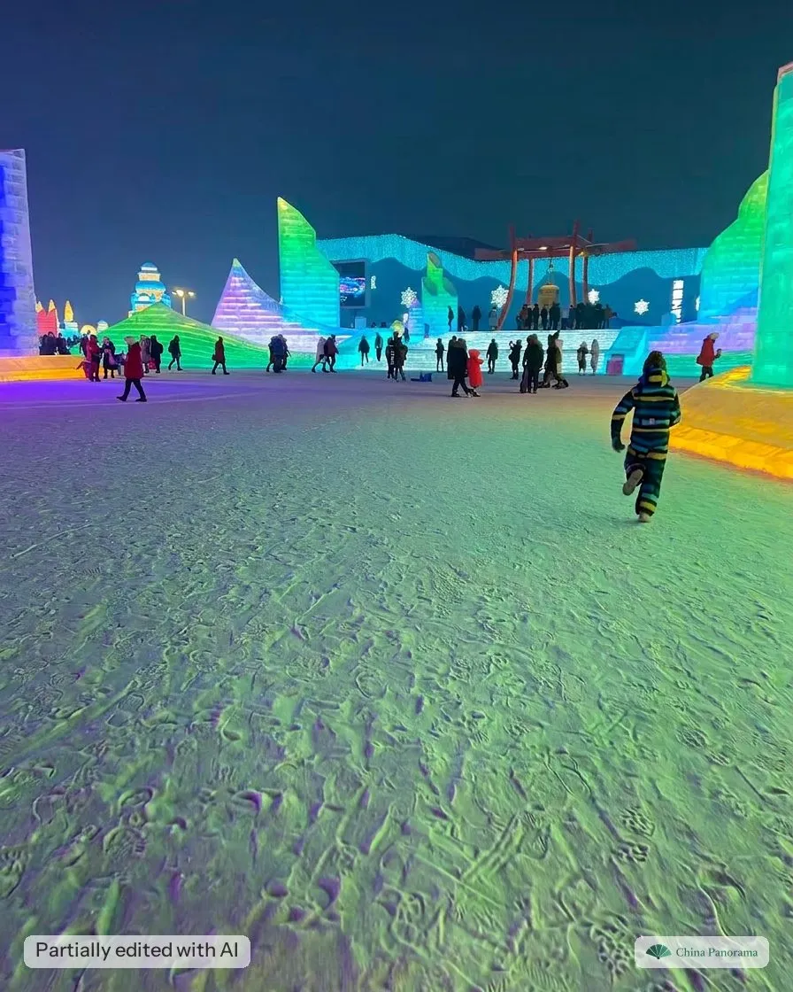 Wide view across the lit ice sculptures of Harbin Ice and Snow World