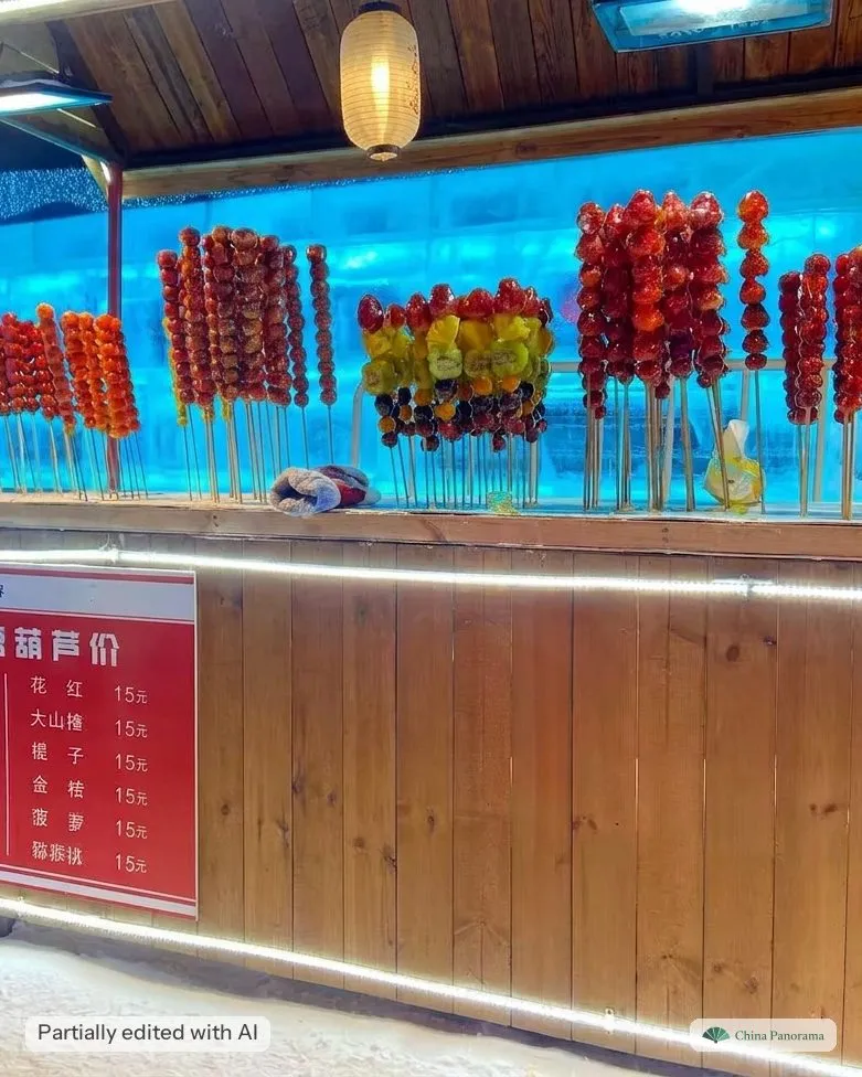 A tanghulu stall built out of ice blocks at Harbin Ice and Snow World, with a price board
