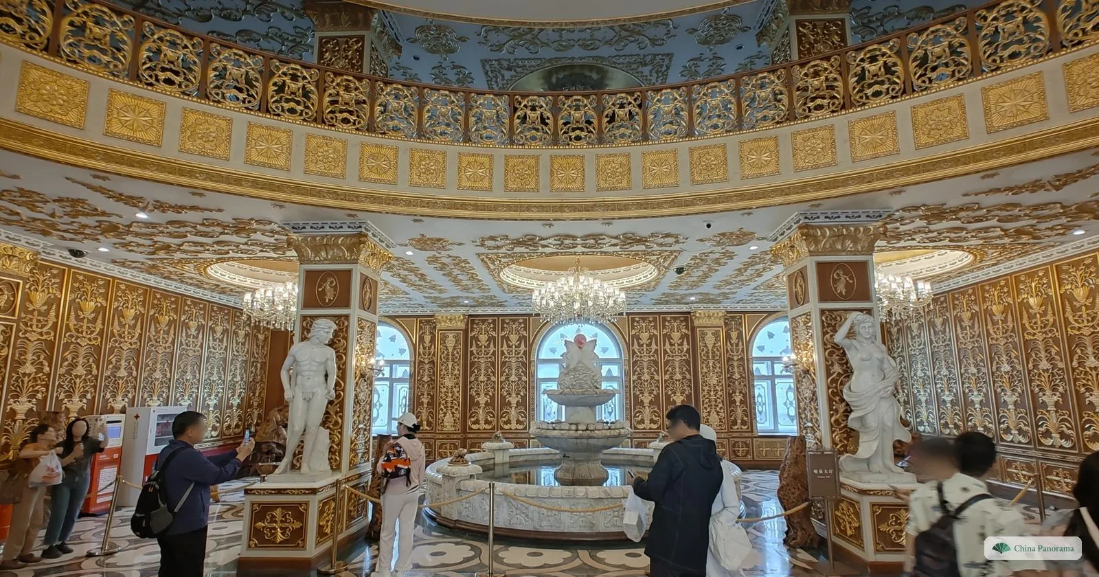 Gilded marble rotunda inside Harbin Pharmaceutical Factory No. 6, with copies of Renaissance sculpture