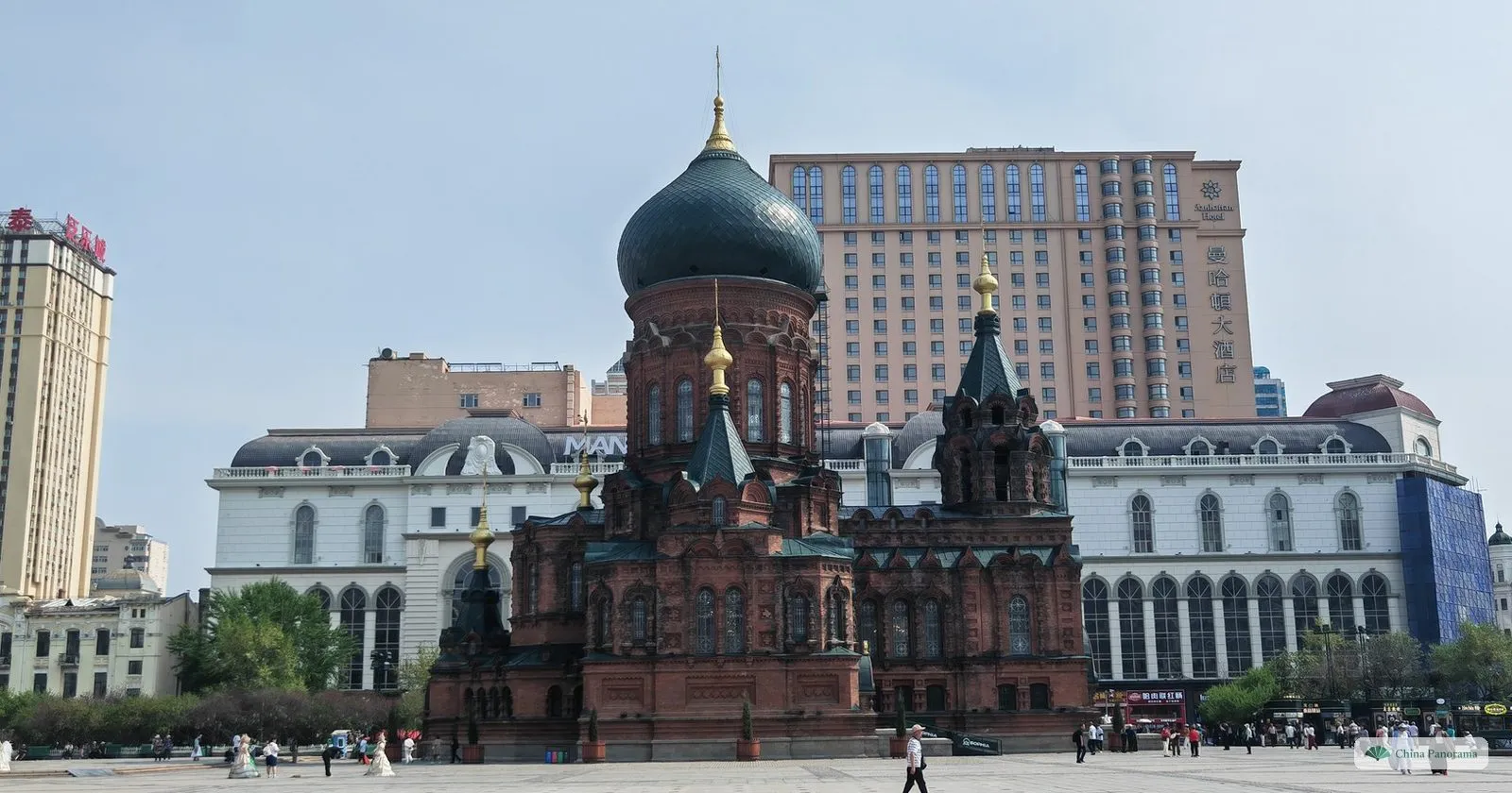 The square around St. Sophia Cathedral in Harbin with modern high-rises behind it