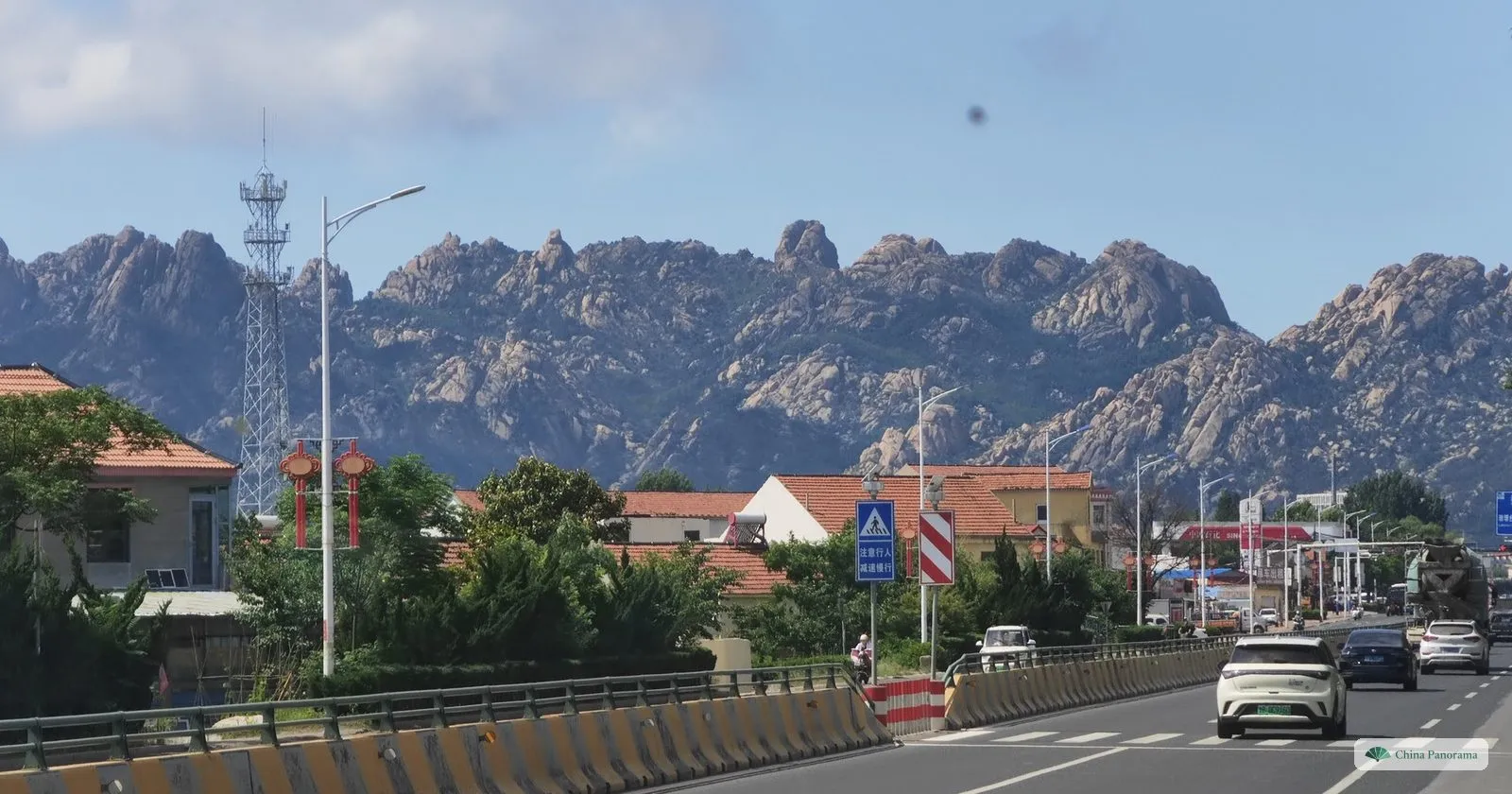 The jagged granite ridge of Mount Laoshan above a road on the eastern edge of Qingdao