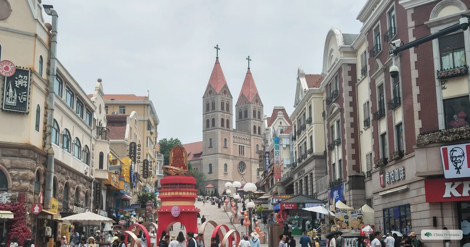Zhongshan Road in Qingdao lined with restored European facades, looking up to the twin spires of St. Michael’s Cathedral