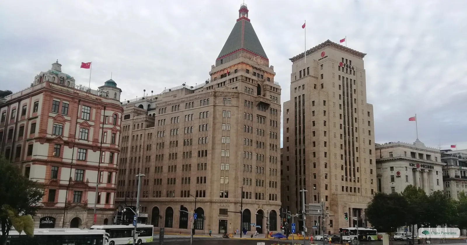 Four buildings on the Bund at the end of Nanjing Road: the red-and-white Swatch Art Peace Hotel, the Peace Hotel with its green pyramid roof, the Bank of China and the ICBC building