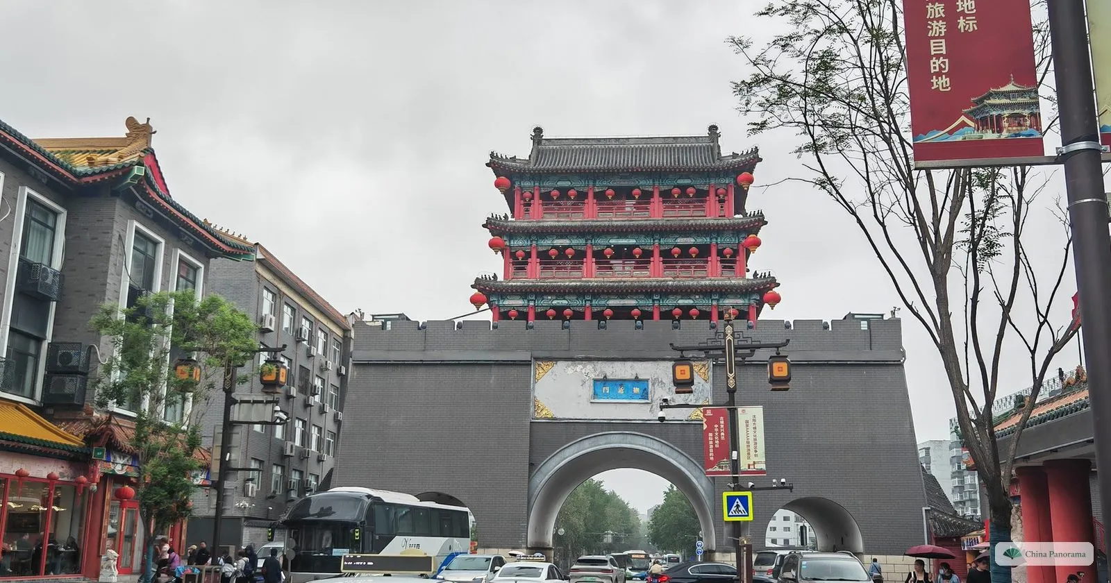 A rebuilt three-storey gate tower on a grey city wall on Dadong Road in Shenyang