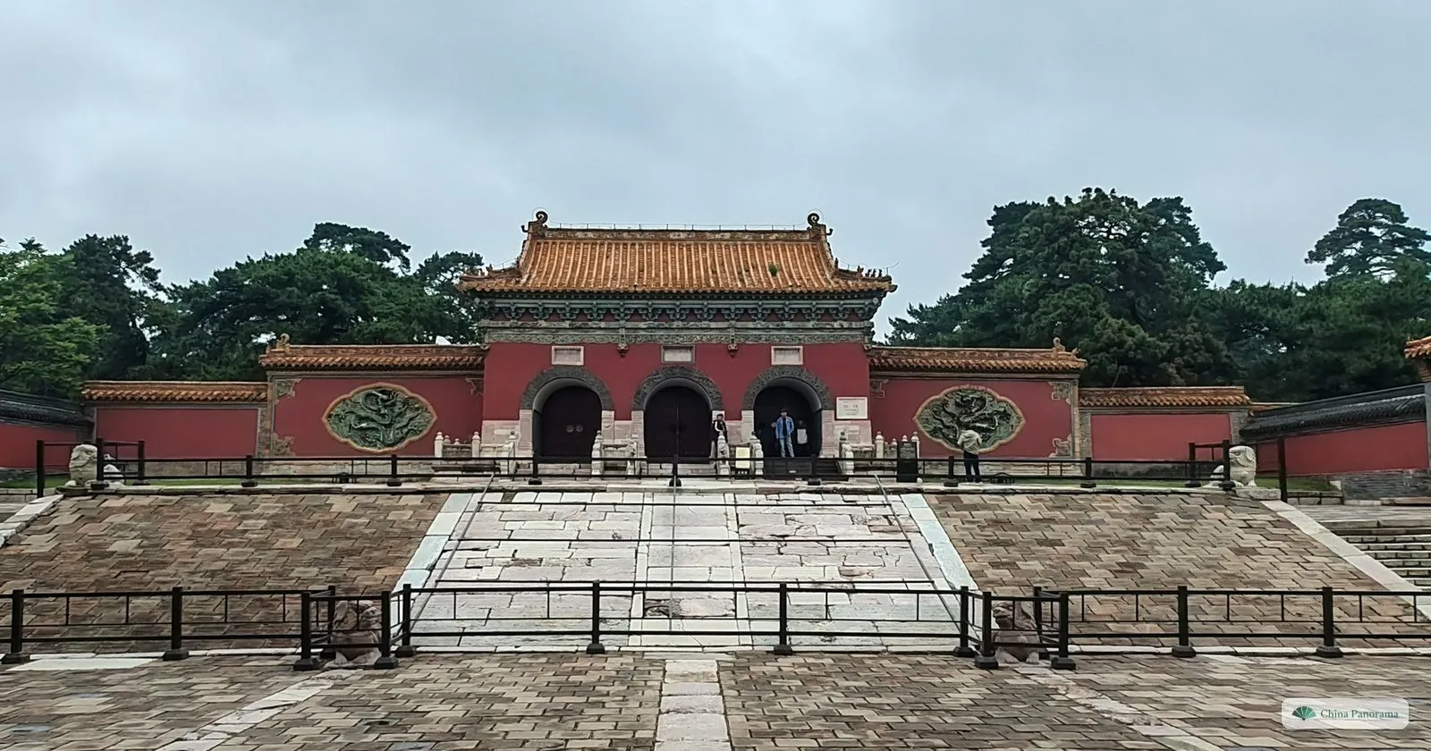 The red walls and yellow-tiled gate of the Zhaoling tomb precinct in Shenyang, at the top of a wide stone ramp