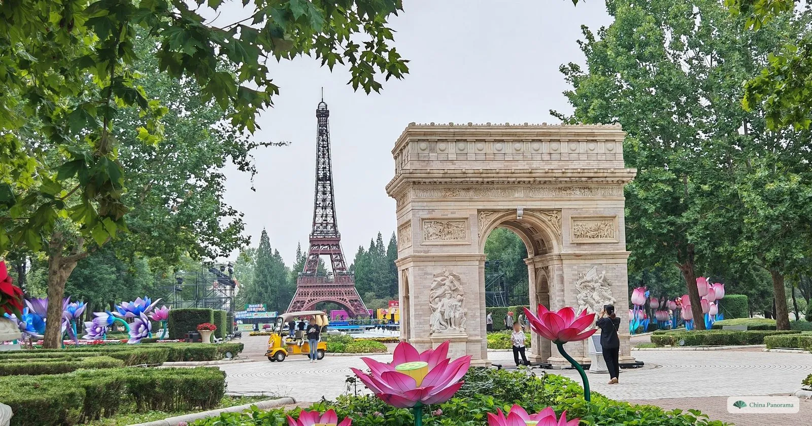 Miniature copies of the Eiffel Tower and the Arc de Triomphe in Beijing World Park, with giant pink lotus lanterns in front